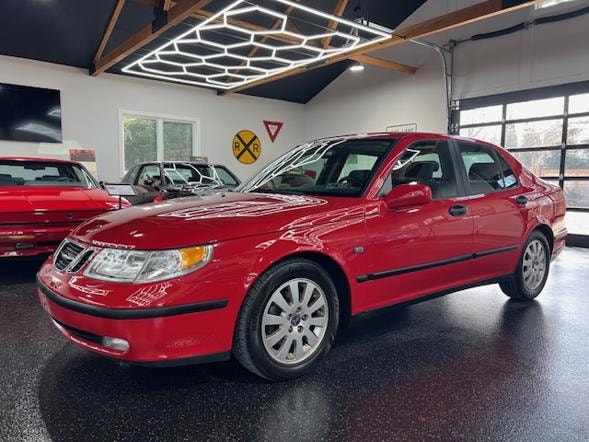Red Saab sedan in showroom
